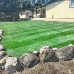 HG&E Outdoor - Nicely laid new sod with a beautiful boulder border