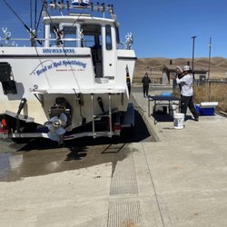 Bend UR Rod SportFishing - Mike is Preparing to filet my sturgeon at Belden's Landing Boat Ramp Suisun City, California