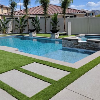 Royal Design Builders - In ground Swimming Pool and Spa with Fire Bowls, water descents and Landscape Turf Concrete sand finish with Steppers - Patio Coverings Near Me