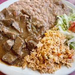 Garne Guisada, rice, and beans
