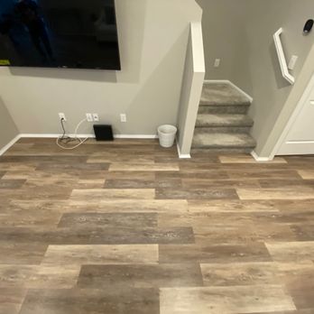 AE Renovations - a view of a living room and stairs - General Contractors Near Me
