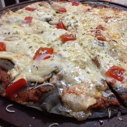 Pizza Negra - Su masa fina, crujiente y negra