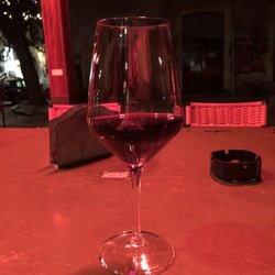 Wine Bar Razmataz - A delicious dry red wine out on the terrace late at night