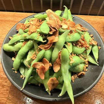 Mensho - Unseasoned edamame with fried garlic thrown on top. - Ramen Near Me - Kapolei, Hawaii Mensho - Unseasoned edamame with fried garlic thrown on top. - Ramen Near Me - Kapolei, Hawaii