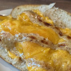 The Buzz of UC Cafe - Bavarian Melt; kielbasa, melty cheddar cheese, sauerkraut, and pub mustard on a pretzel sub roll.