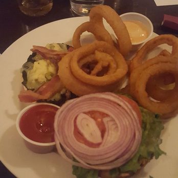 Galway Arms - cheddar bacon burger w/ onion rings $13.95 + $1.95 - Irish Near Me - Chicago, Illinois Galway Arms - cheddar bacon burger w/ onion rings $13.95 + $1.95 - Irish Near Me - Chicago, Illinois