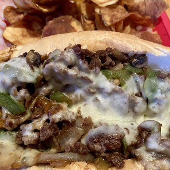 Grinders Stonewall - Philly Cheese Steak Sandwich with house made chips - Pizza Near Me - Lenexa, Kansas Grinders Stonewall - Philly Cheese Steak Sandwich with house made chips - Pizza Near Me - Lenexa, Kansas