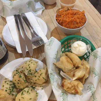 Baba's Pierogies - Pierogi spread and carrot slaw - Modern European Near Me - Brooklyn, New York