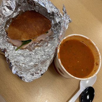 Yellow Bird Cafe - sandwich wrapped in tin foil next to a bowl of soup - Cafes Near Me - Harrisburg, Pennsylvania Yellow Bird Cafe - sandwich wrapped in tin foil next to a bowl of soup - Cafes Near Me - Harrisburg, Pennsylvania