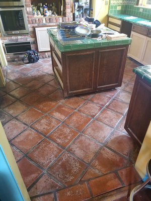 Saltillo tile restoration cleaning and sealing - Saltillo tile, Tecate tile ,Spanish tiles no matter what you know them as they are a very difficult floor to restore lots of time elbow grease, and knowledge goes in to doing a proper restoration job. 
In these photos, the floors have been neglected for over 15 years. Lots of wax buildup had to be removed with multiple stripping processes. Once our clients were happy with the results we applied several coats of a low luster finish to ensure longevity of these floors.