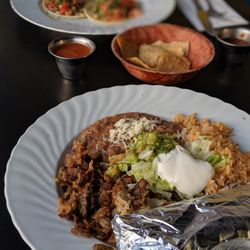 Viva Mexicana - carnitas plate in fg, tacos a la carte in bg