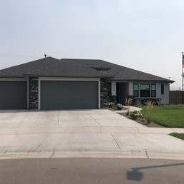a house with a flag in the front yard a house with a flag in the front yard