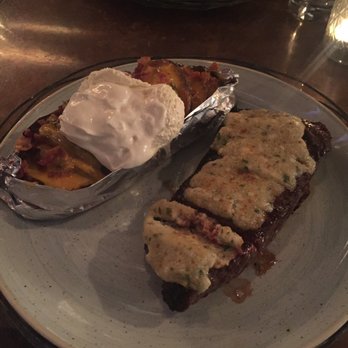 Le Moo - 14 oz choice New York Strip with blue cheese crust and the loaded baked potato! - Steakhouses Near Me - Louisville, Kentucky Le Moo - 14 oz choice New York Strip with blue cheese crust and the loaded baked potato! - Steakhouses Near Me - Louisville, Kentucky