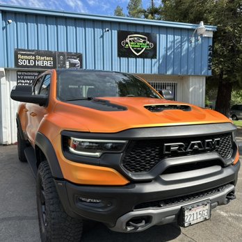 Tint Wrap & Audio Guys - 2021 RAM TRX, we wrapped in Satin Stunning Orange by Avery Dennison - Car Window Tinting Near Me - Clovis, California