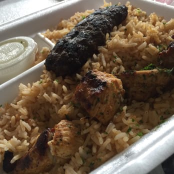 Gyroz Mediterranean Eatery - My mixed platter : chicken and beef/lamb kabobs on a large portion of rice. With a side of watery garlic sauce - Mediterranean Near Me - Lexington, Kentucky