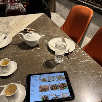 MingHin Cuisine - Complementary tea and here's the tablet of menu items - Dim Sum Near Me - Chicago, Illinois MingHin Cuisine - Complementary tea and here's the tablet of menu items - Dim Sum Near Me - Chicago, Illinois