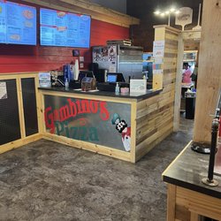 Gambino's Pizza - Counter with menu on screens