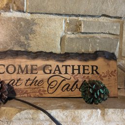 a sign that reads come gather at the table