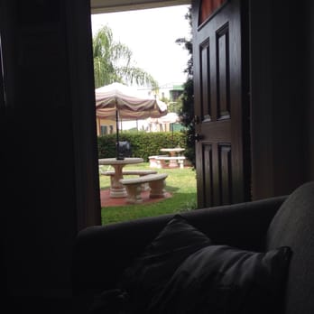 Carousel Suites - Love that I can sit in the sofa and have the door open and look out to a cute court yard - Hotels Near Me - Redingtn Shor, Florida Carousel Suites - Love that I can sit in the sofa and have the door open and look out to a cute court yard - Hotels Near Me - Redingtn Shor, Florida