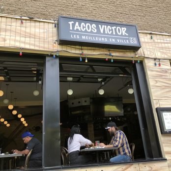 Tacos Victor - two men sitting at a table - Mexican Near Me - Montréal-Ouest, Quebec Tacos Victor - two men sitting at a table - Mexican Near Me - Montréal-Ouest, Quebec