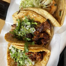 Tacos (left to right) chorizo, pastor, shrimp Tacos (left to right) chorizo, pastor, shrimp
