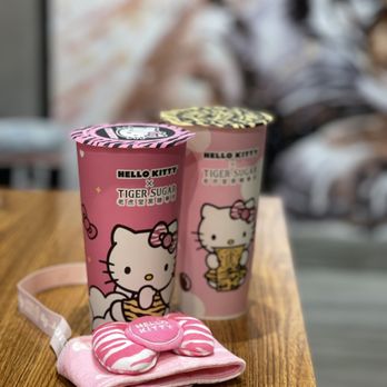 Tiger Sugar - a hello kitty cup and a pink bag on a table - Bubble Tea Near Me - Chicago, Illinois Tiger Sugar - a hello kitty cup and a pink bag on a table - Bubble Tea Near Me - Chicago, Illinois