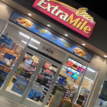 Chevron - the entrance of a store at night - Gas Stations Near Me - Santa Fe Springs, California