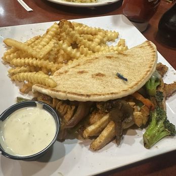 Bakers Square - Stir-Fry Pita- filled with chicken, broccoli, onions, peppers, pea pods, mushrooms! I love to get a side of ranch to dip! So good!! - American Near Me - Coon Rapids, Minnesota