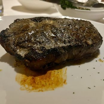 Eddie V's Prime Seafood - 18 oz USDA Prime Bone-In New York Strip with Smoked Chili Rub - Seafood Near Me - Plano, Texas Eddie V's Prime Seafood - 18 oz USDA Prime Bone-In New York Strip with Smoked Chili Rub - Seafood Near Me - Plano, Texas