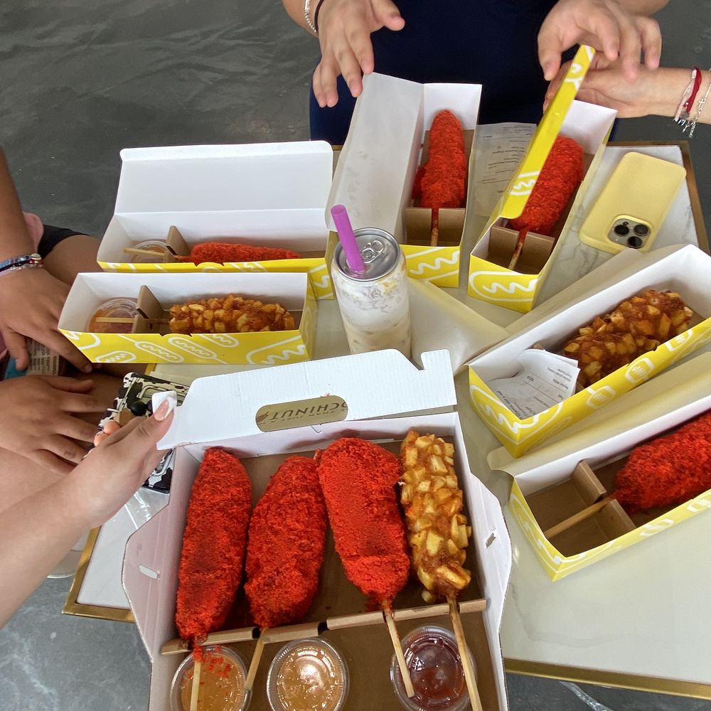 Mochinut - hot Cheetos corn dogs  Potato corn dog  crispy romaine corn dog  Half hot Cheeto half hotdog - Donuts Near Me - Cary, North Carolina
