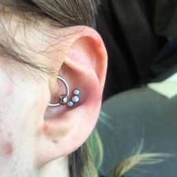 Fresh conch with 3 white opals! Daith was done by Noah, someone who was being supervised by Fish.