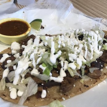 Machete Taqueria - Huarache with bistek (carne asada)... beans lettuce and fresh cheese - New Mexican Cuisine Near Me - Redlands, California Machete Taqueria - Huarache with bistek (carne asada)... beans lettuce and fresh cheese - New Mexican Cuisine Near Me - Redlands, California