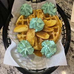 Pressed Coffee Bar and Eatery - Waffles decked out with green whipped cream for St Pat's Day.