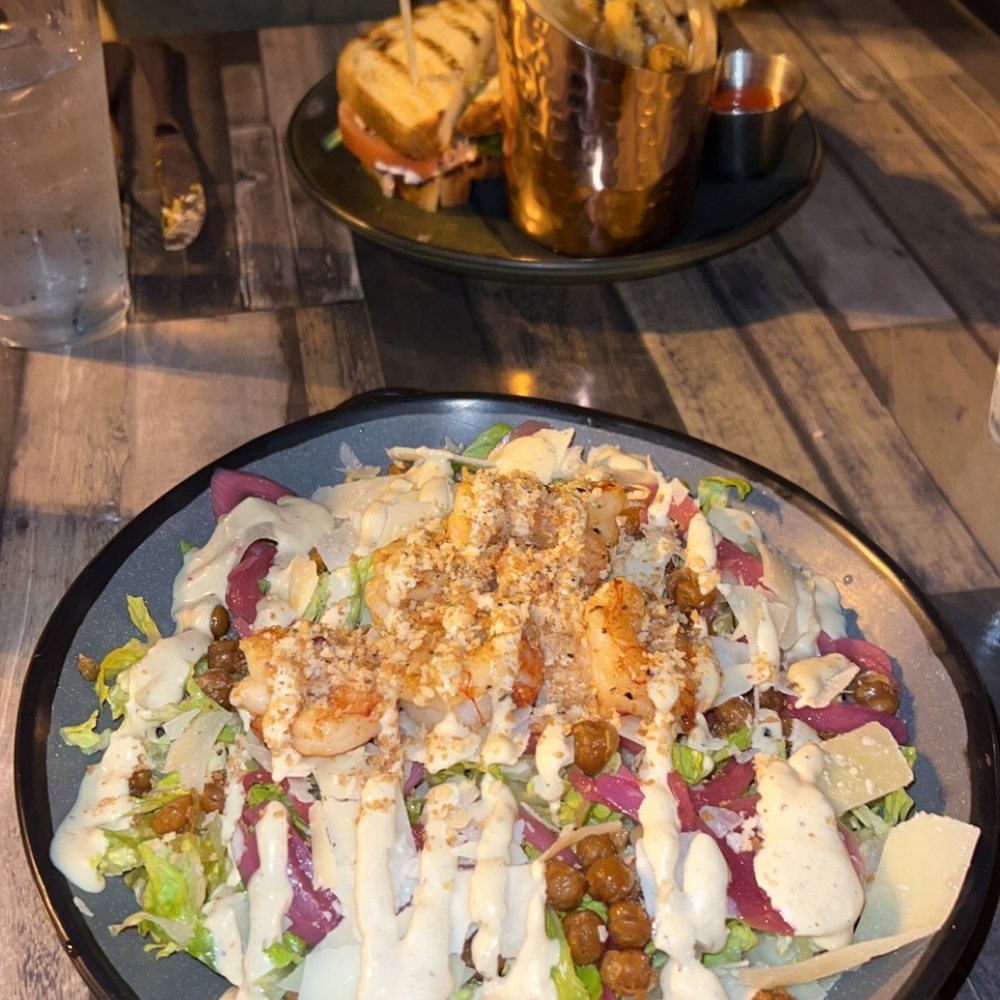 The Stubborn Mule - Tuscan Caesar salad and smashed salmon sandwich - New American Near Me - Orlando, Florida The Stubborn Mule - Tuscan Caesar salad and smashed salmon sandwich - New American Near Me - Orlando, Florida