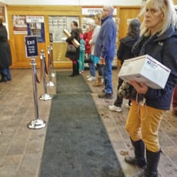 US Post Office - This is the average line length that I see each time I visit, with only 1 or 2 employees working. This lady's face says it all.