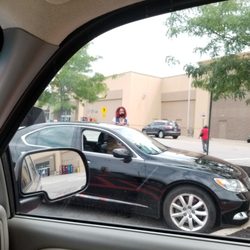 Walmart worker standing , MASK UNDER NOSE. ZOOM IN