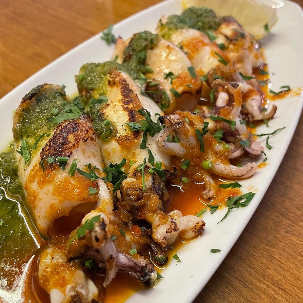 Tossa - Grilled squid with pesto - Tapas Bars Near Me - Barcelona, B Tossa - Grilled squid with pesto - Tapas Bars Near Me - Barcelona, B