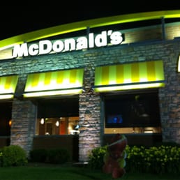 a fire hydrant in front of a mcdonald's a fire hydrant in front of a mcdonald's