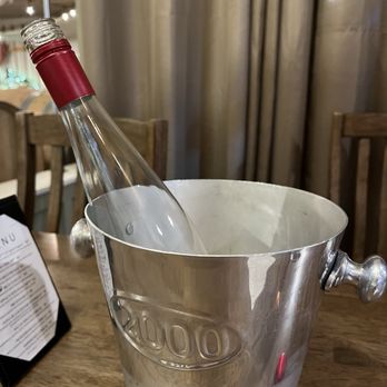 Fireside Winery - Ok - so this bottle might be halfway empty, but they will refill it with anything you like!! - Wineries Near Me - Marengo, Iowa