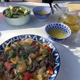 Lagman, avocado salad, and mango tea Lagman, avocado salad, and mango tea