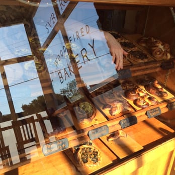 Sub Rosa Bakery - View of bakery case with reflection of outside window. - Bakeries Near Me - Richmond, Virginia