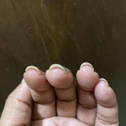 Ruby Nails - That middle nail is thick because there's still acrylic at the end.
