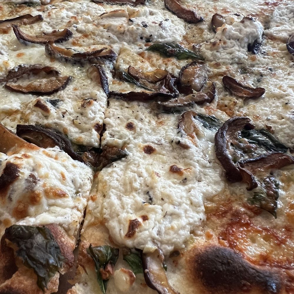 White pie, truffle, and mushrooms. White pie, truffle, and mushrooms.