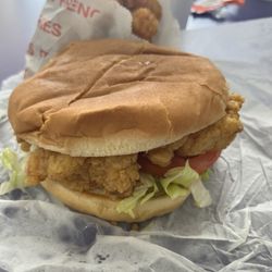 Griffin Grill - Shrimp on a bun with a side of tater tots.