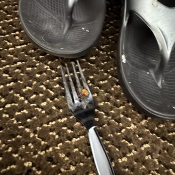 Endeavor Inn & Suites - Found someone else's shoes and a used fork on the floor in the one bedroom - Hotels Near Me - Topeka, Kansas