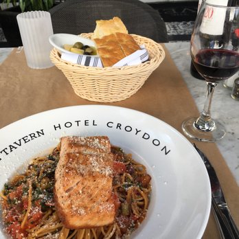 The Tavern - Fresh Grilled Salmon - Wild caught salmon served on whole wheat spaghetti and rapini in a garlic-white wine sauce ($22) - Breakfast & Brunch Near Me - Miami Beach, Florida