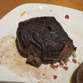 Outback Steakhouse - My hockey puck medium steak. - Steakhouses Near Me - Jackson, Michigan