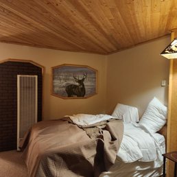 Comfortable bed. Notice all the wood accents. Comfortable bed. Notice all the wood accents.