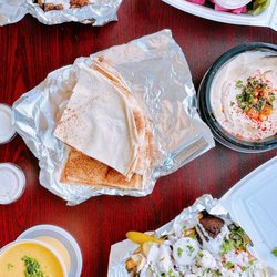 The Levant Kitchen - Clockwise: Tahini & cauliflower, falafel plate, hummus & pita, loaded fries + falafel, lentil soup!