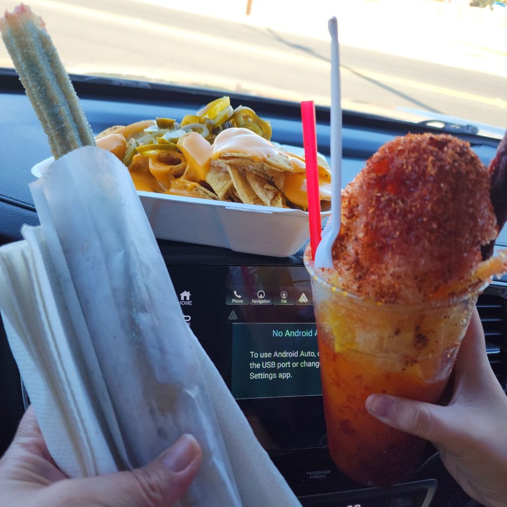 Spookie fruiti (Grape flavored sugar) Churro, Mangonada, and nachos... Spookie fruiti (Grape flavored sugar) Churro, Mangonada, and nachos...